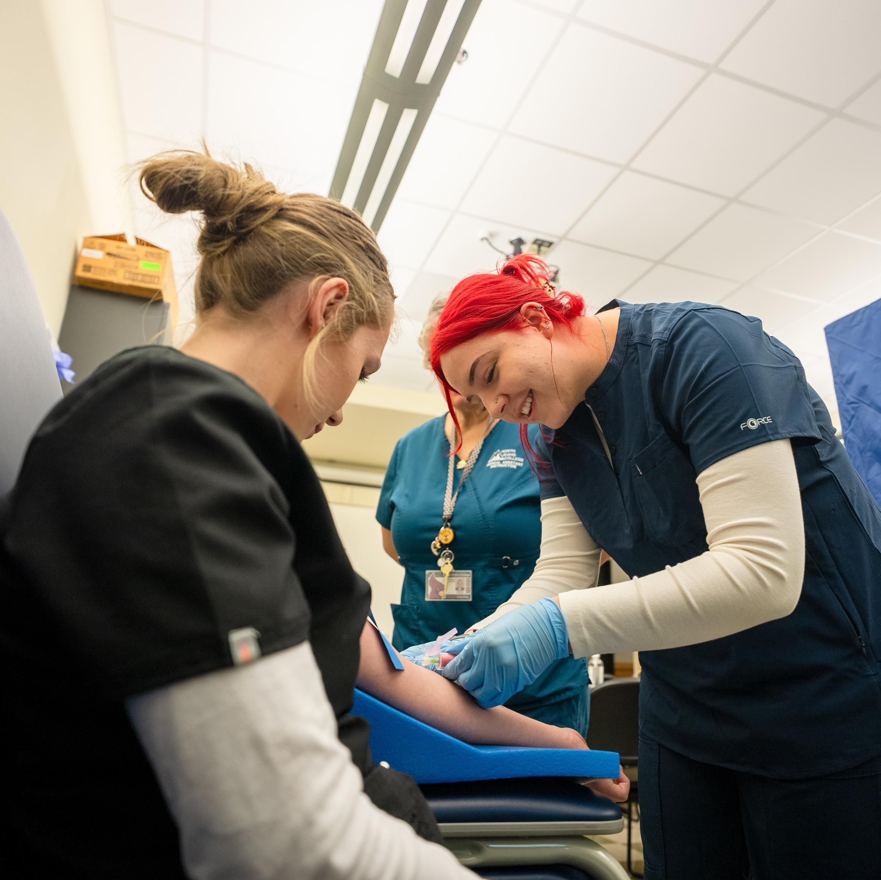 Medical Assistant class 2 students practicing giving shots