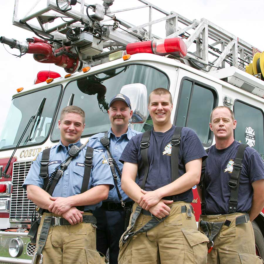 Fire Fighters in front of their fire engine