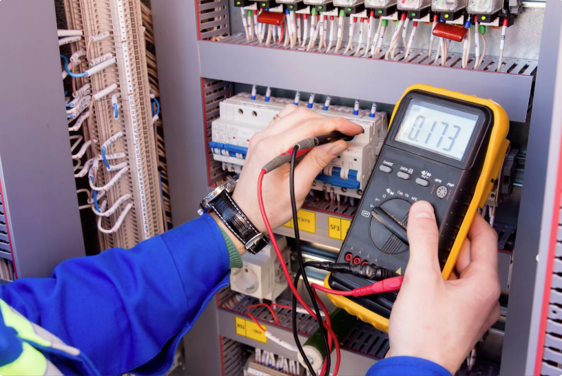 Ohmmeter being used to test electrical equipment